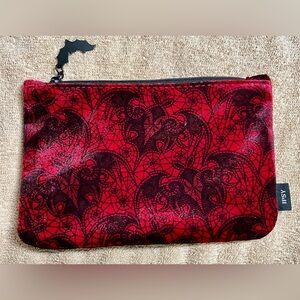 Black spider webs and bats on red velvet cosmetics bag. Goth Witchy Dark Fairy